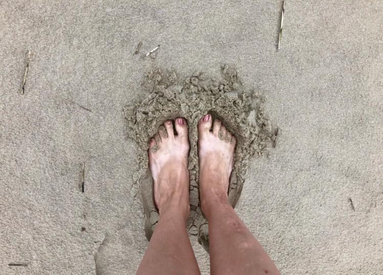 68e3dcea18f27_feet in sand